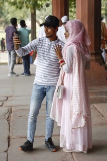 Young Indian couple taking a selfie photo at Diwan i Am