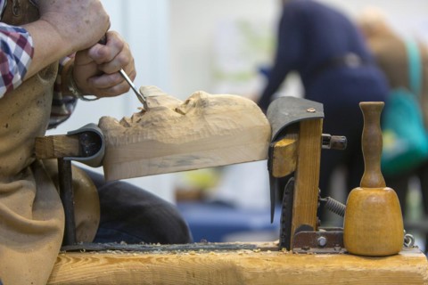 Maskenschnnitzer works on a wooden mask for a Swabian-Alemannic Fasnet figure