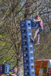 Child secured by rope falls while building tower out of beer crates