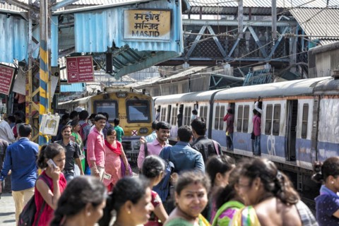 Crowded trains and passengers at MASJID STATION of the Central Line