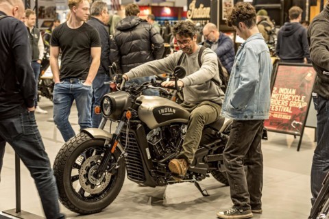 Man sits test on motorbike Indian Scout Bobber