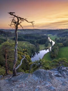 View from Petersgrat in the Franconian Forest of the river Saale at sunset
