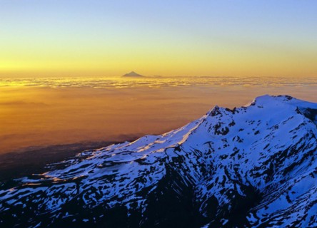 Aerial view of Mount Ruapehu with Mount Taranaki seen in the far distance North Island New Zealand