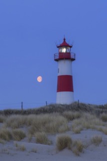 Red and white striped lighthouse List East