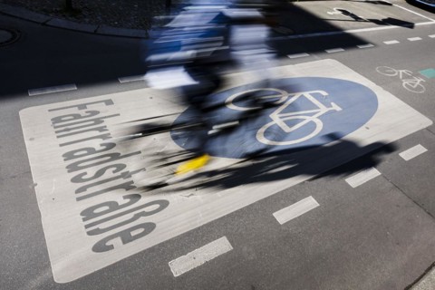 Symbolic photo on the subject of bicycle lanes in the city. Cyclists ride on the bicycle street in Linienstrasse in Berlin Mitte. Berlin