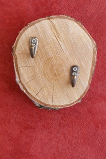 Coat hook on wooden disc