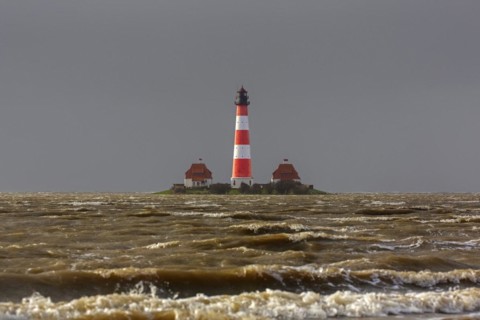 Lighthouse Westerheversand at Westerhever during high water spring tide