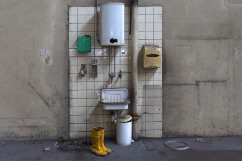 Hand basin with instantaneous water heater in a factory hall in a former paper factory