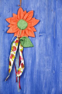 Fabric flower on blue background