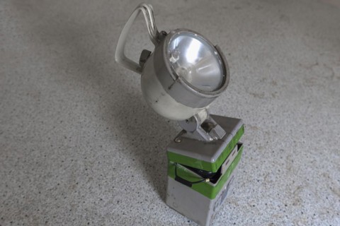 Handheld spotlight in an abandoned office of a former paper factory