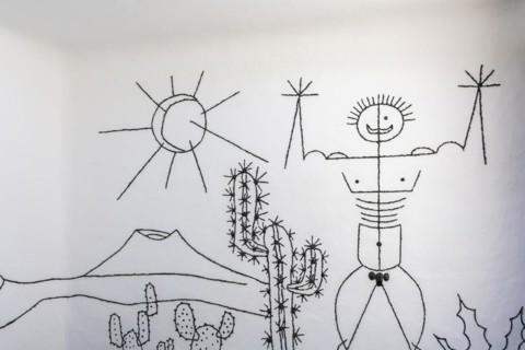 Artfully designed sign at the men's toilet