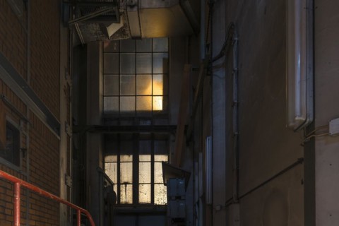 Window to the staircase in the powerhouse of a former paper factory