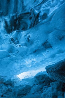 Blue ice mixed with volcanic ash in ice cavern inside Breidamerkurjokull