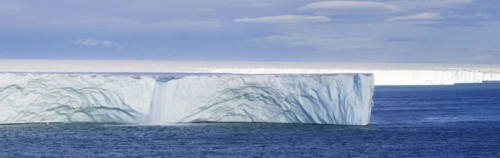 Waterfall at edge of the Brasvellbreen glacier from the ice cap Austfonna debouching into the Barents Sea