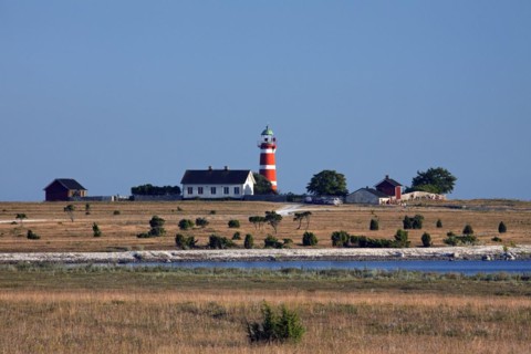 The red and white lighthouse Naers fyr at Naersholmen on the island Gotland
