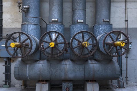 Large steam regulators in a former paper factory