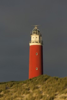 Eierland Lighthouse in the dunes during stormy weather on the northernmost tip of the Dutch island of Texel