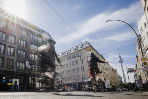Symbolic photo on the subject of cycling in the city. Cyclists ride on the bicycle lane in Linienstrasse in Berlin Mitte. Berlin