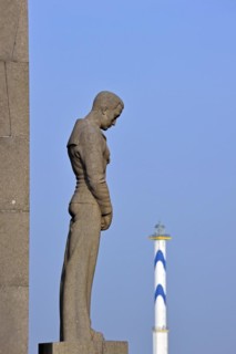 Monument for the sailors and fishermen who died at sea and the lighthouse Lange Nelle at Ostend