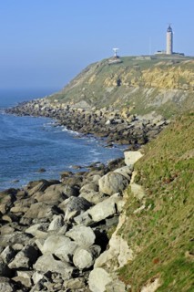 Lighthouse and sandstone boulders from cliff on beach at Cap Gris Nez