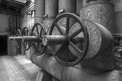 Large steam regulators of a former paper factory