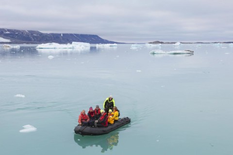 Zodiac boat with eco-tourists visiting Monacobreen