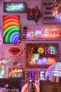 Room full of bright colourful neon signs