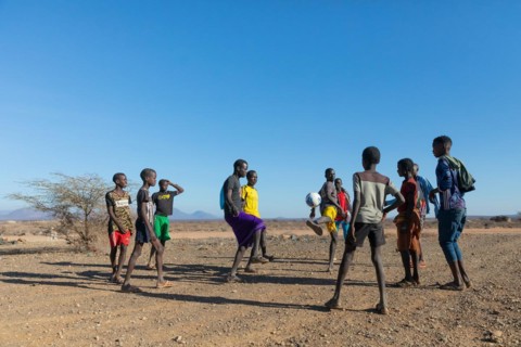 Group of young men playing football