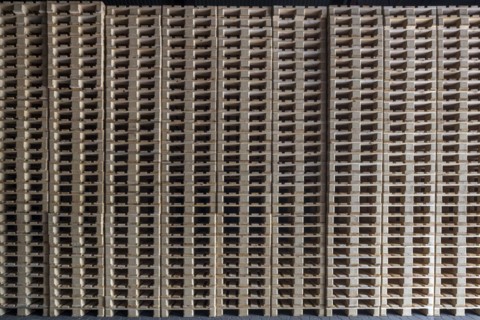 Stacked euro pallets in a former paper factory