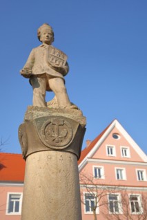Pretzel fountain with figure and city coat of arms