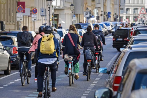 Symbolic photo on the subject of bicycle lanes in the city. Cyclists ride on the bicycle street in Linienstrasse in Berlin Mitte. Berlin