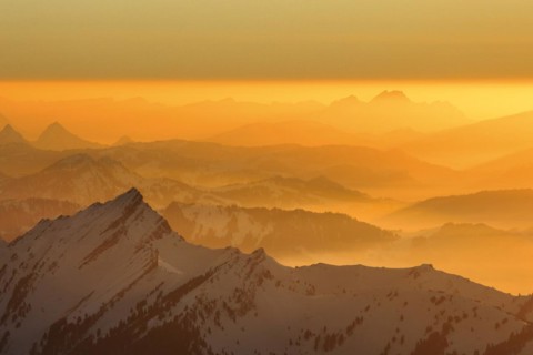 Golden sunset in winter with view from Saentis to Pilatus in Central Switzerland