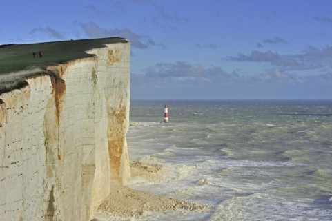 View over the eroded white chalk cliffs and lighthouse at Beachy Head