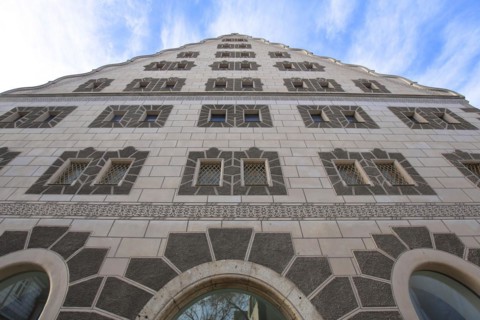 Historic Renaissance granary with sgraffiti and ornaments looking up