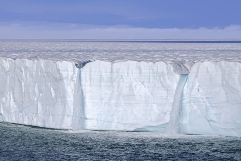Waterfalls at edge of the Brasvellbreen glacier from the ice cap Austfonna debouching into the Barents Sea