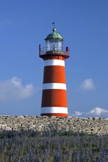 The red and white lighthouse Naers fyr at Naersholmen on the island Gotland