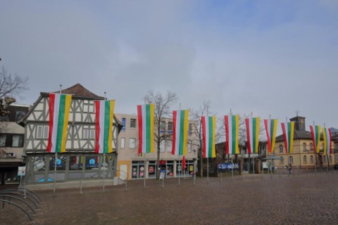Market place with flags and town hall