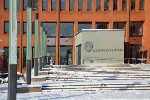 District office with snow in winter with coat of arms and inscription Main-Taunus-Kreis