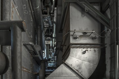 Heating pipes in the power house with boiler plant of a former paper factory