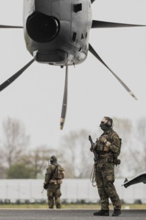Soldiers of the German Armed Forces sign off in front of the Airbus A400M aircraft