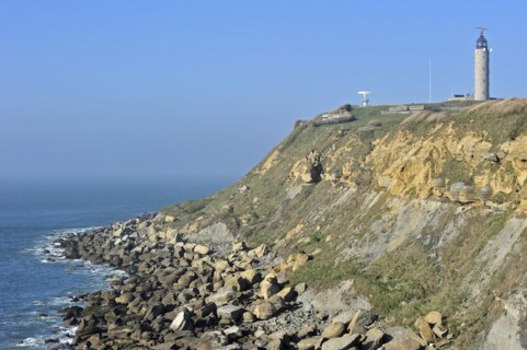 Lighthouse and sandstone boulders from cliff on beach at Cap Gris Nez