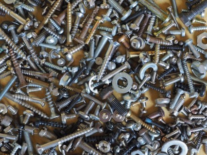 Industrial steel hardware bolt nut screw washer useful as a background