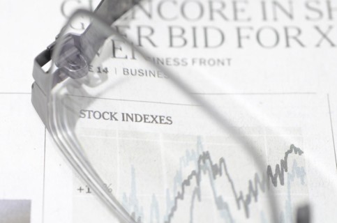 Financial Newspaper and Eyeglasses