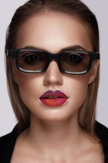 Beautiful caucasian woman with creative makeup and purple lips. Beauty face. Art makeup