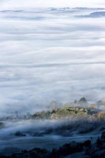 View from the Zeller Horn on misty landscape of the Swabian Alb