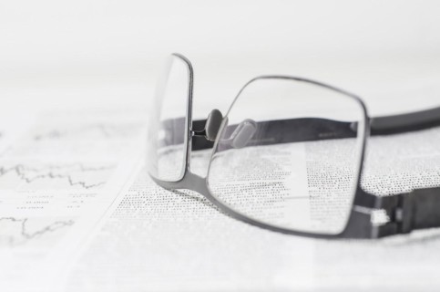 Financial Newspaper and Eyeglasses