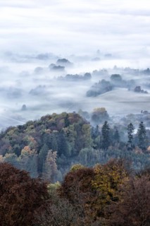 View from the Zeller Horn on misty landscape of the Swabian Alb