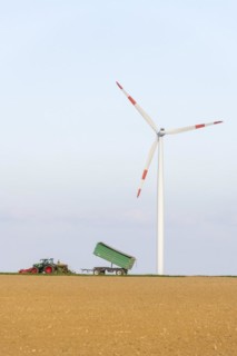 Tractor with trailer sowing grain in a field