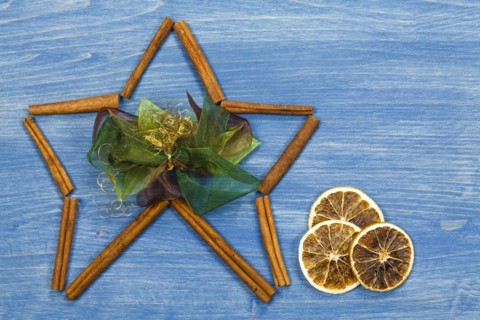 Star of cinnamon sticks on a blue background