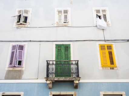 House facade with colourful shutters